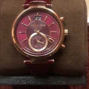 Women’s MK leather strap watch. Couple years old.